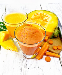 Image showing Juice carrot and pumpkin on light board