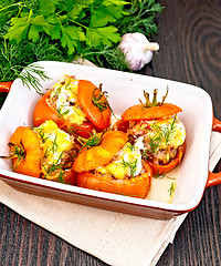 Image showing Tomatoes stuffed with rice and meat in brazier on board