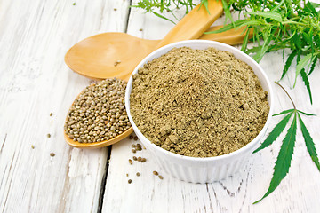 Image showing Flour hemp in bowl with spoons on board