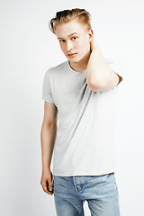 Image showing young handsome teenage hipster guy posing emotional, happy smiling against white background isolated, lifestyle people concept closeup