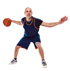 Image showing Full length portrait of a basketball player with ball