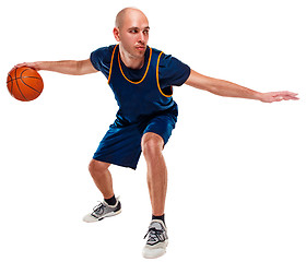 Image showing Full length portrait of a basketball player with ball