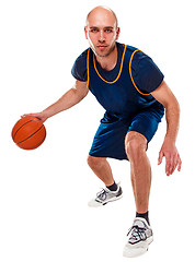 Image showing Full length portrait of a basketball player with ball