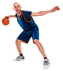 Image showing Full length portrait of a basketball player with ball