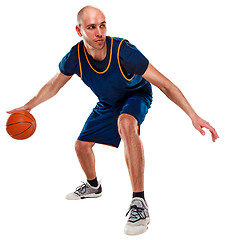 Image showing Full length portrait of a basketball player with ball