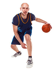 Image showing Full length portrait of a basketball player with ball