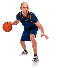 Image showing Full length portrait of a basketball player with ball