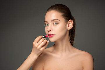 Image showing Beautiful female lips with make-up and brush