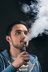 Image showing The face of vaping young man