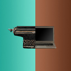 Image showing Very old fashion typewriter and laptop