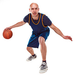 Image showing Full length portrait of a basketball player with ball