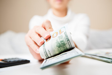 Image showing Hands counting money, close up