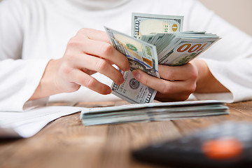 Image showing Hands counting money, close up