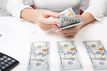 Image showing Hands counting money, close up