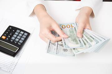 Image showing Hands counting money, close up