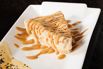 Image showing Delicious cheesecake with caramel topping