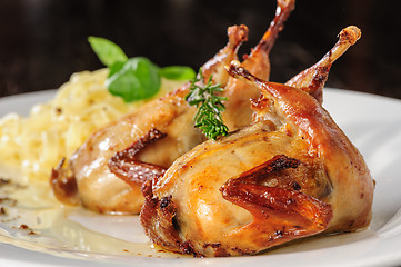 Image showing Roasted or fried quail with herbs and tagliatelle