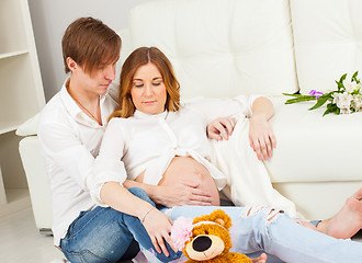 Image showing Young man and pregnant woman waiting for a newborn