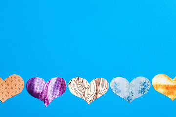 Image showing multicolored hearts on a blue background