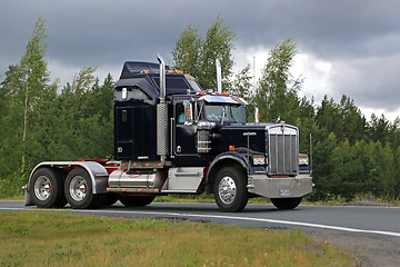 Image showing Classic Black Kenworth W900B on a Cloudy Day 