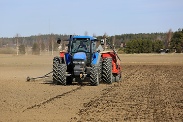 Image showing Farm Tractor and Seed Drill on Field