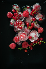 Image showing Frozen berries on wooden table