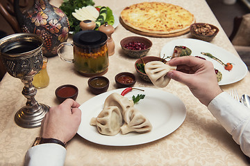 Image showing Man eating in georgian restaurant