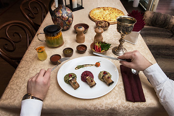 Image showing Man eating in georgian restaurant