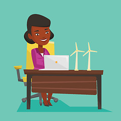 Image showing Woman working with model of wind turbines.