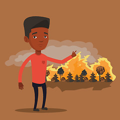 Image showing Man standing on background of wildfire.