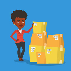 Image showing Business woman checking boxes in warehouse.