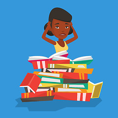 Image showing Student sitting in huge pile of books.