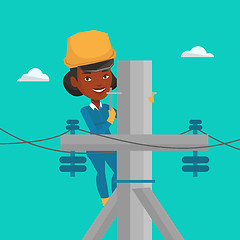 Image showing Electrician working on electric power pole.