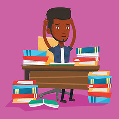 Image showing Student sitting at the table with piles of books.