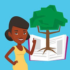 Image showing Student pointing at tree of knowledge.