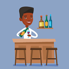 Image showing Bartender standing at the bar counter.