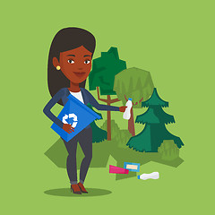 Image showing Woman collecting garbage in forest.