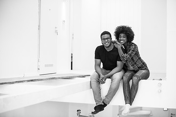 Image showing couple having break during moving to new house