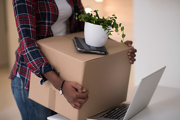 Image showing Black girl moving in the new apartment