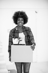 Image showing Black girl moving in the new apartment