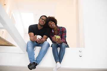 Image showing couple having break during moving to new house