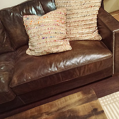 Image showing Classic brown leather sofa with cushions