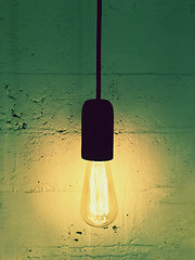 Image showing Simple light bulb on a black cord