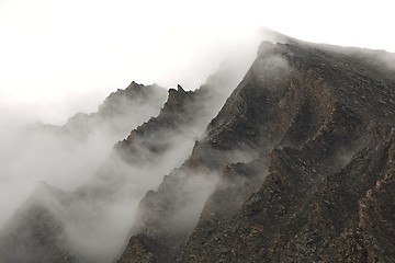 Image showing Mountain cliffs in fog