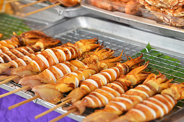 Image showing Grilled bbq squids on sticks