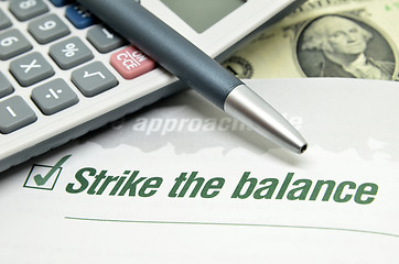 Image showing Strike the balance