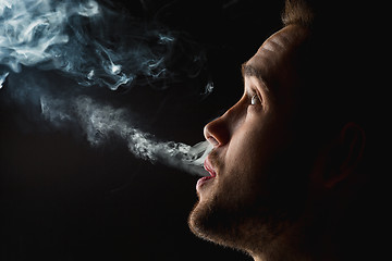 Image showing The face of vaping young man