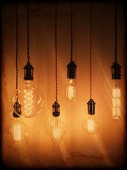 Image showing Illuminated light bulbs on a vintage background