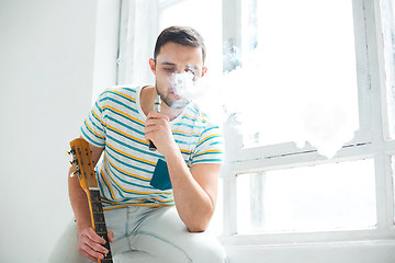 Image showing The face of vaping young man