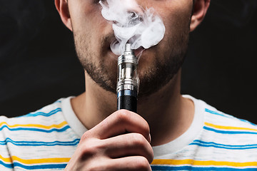 Image showing The face of vaping young man